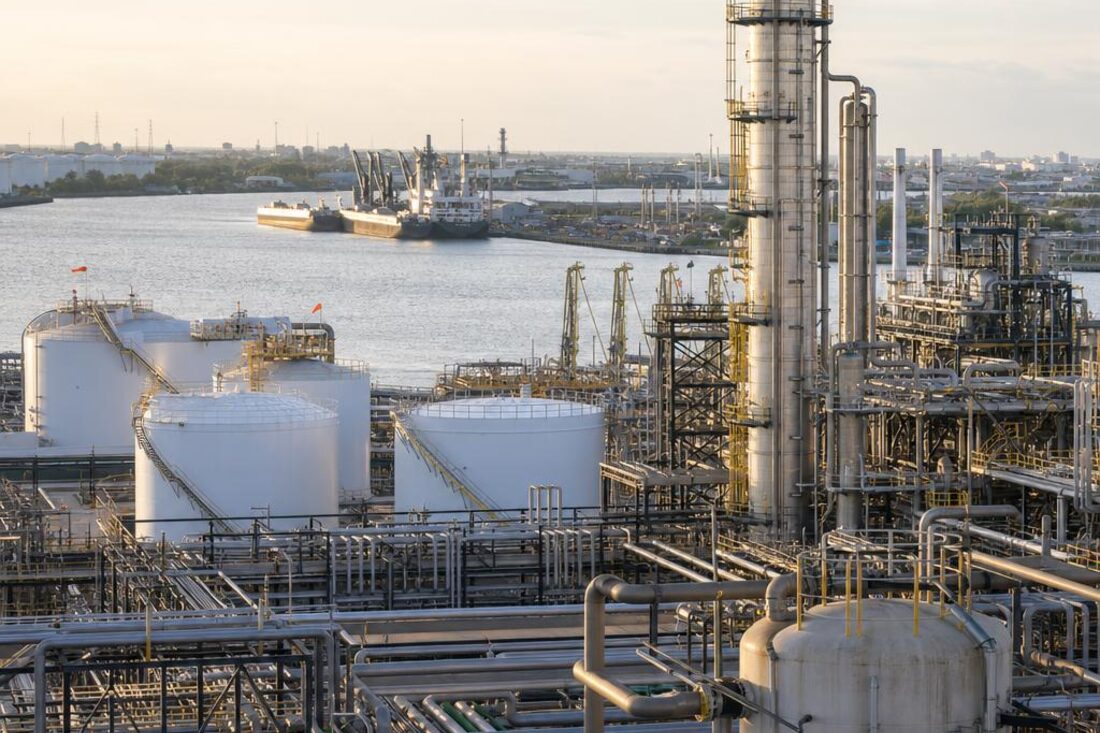 Gulf Coast industrial manufacturing plant with process piping and storage tanks